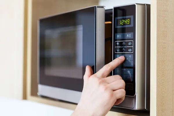 Depositphotos 42460179 Stock Photo Using Microwave Oven