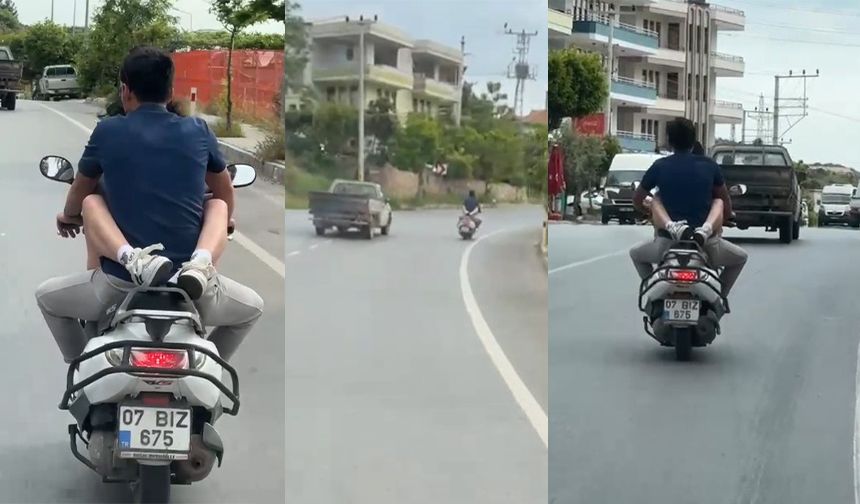 Motosiklette kucağında yolcu taşıdı