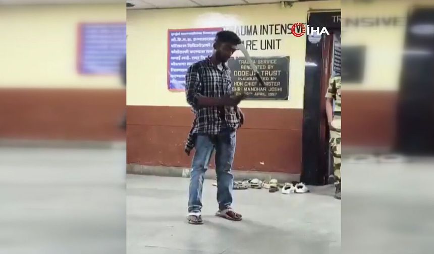 Başına pala saplanan genç telefon kullanmaya devam etti